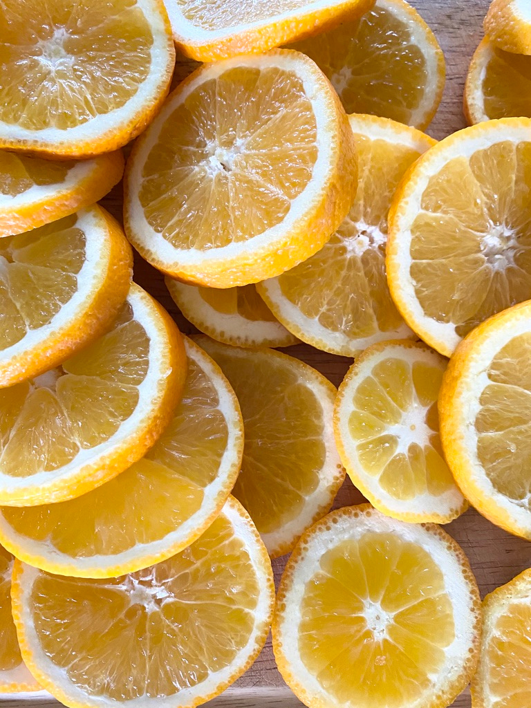 Fresh sliced oranges on a cutting board